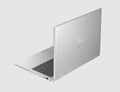 Silver HP laptop on a light gray background